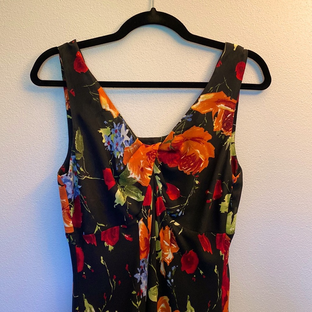 Beautiful, flowing floral tribal dress. Polyester shell & lining.